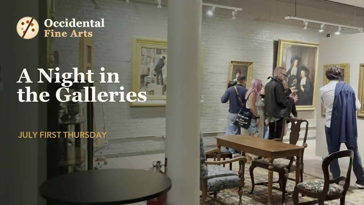 Visitors looking at framed paintings in the upstairs galleries