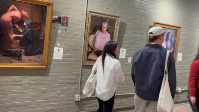 Visitors looking at paintings by Seattle Prize Fellows during First Thursday at the Occidental Fine Arts Center.