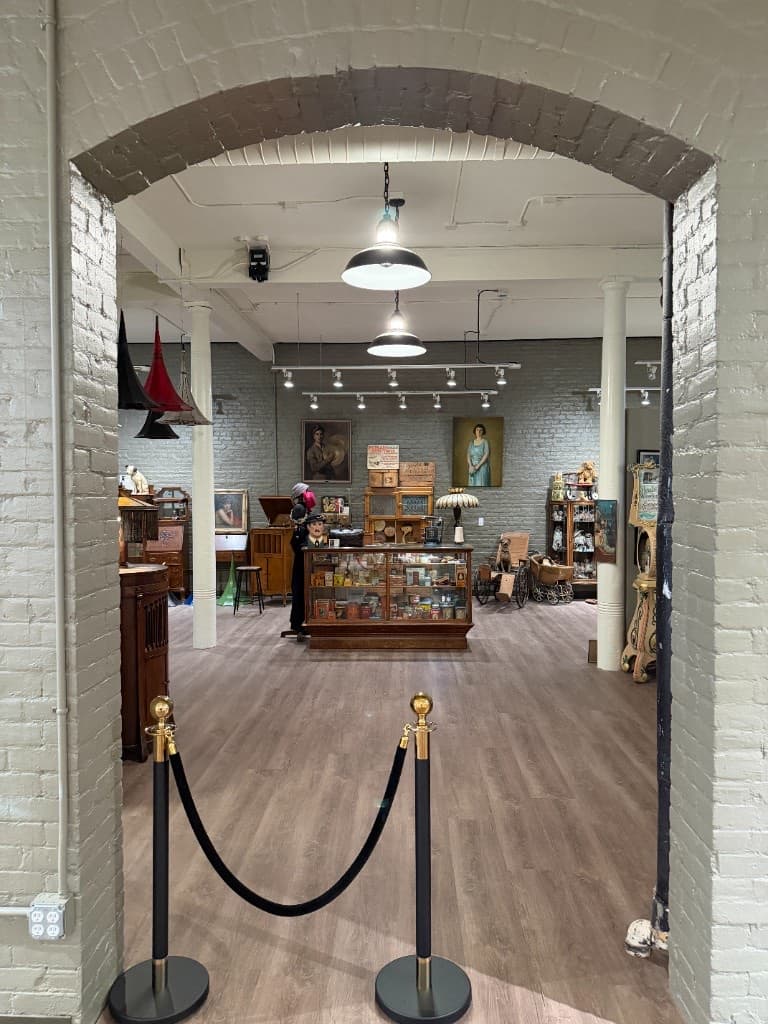 A brick archway and gallery interior at the Beautiful Things exhibition.