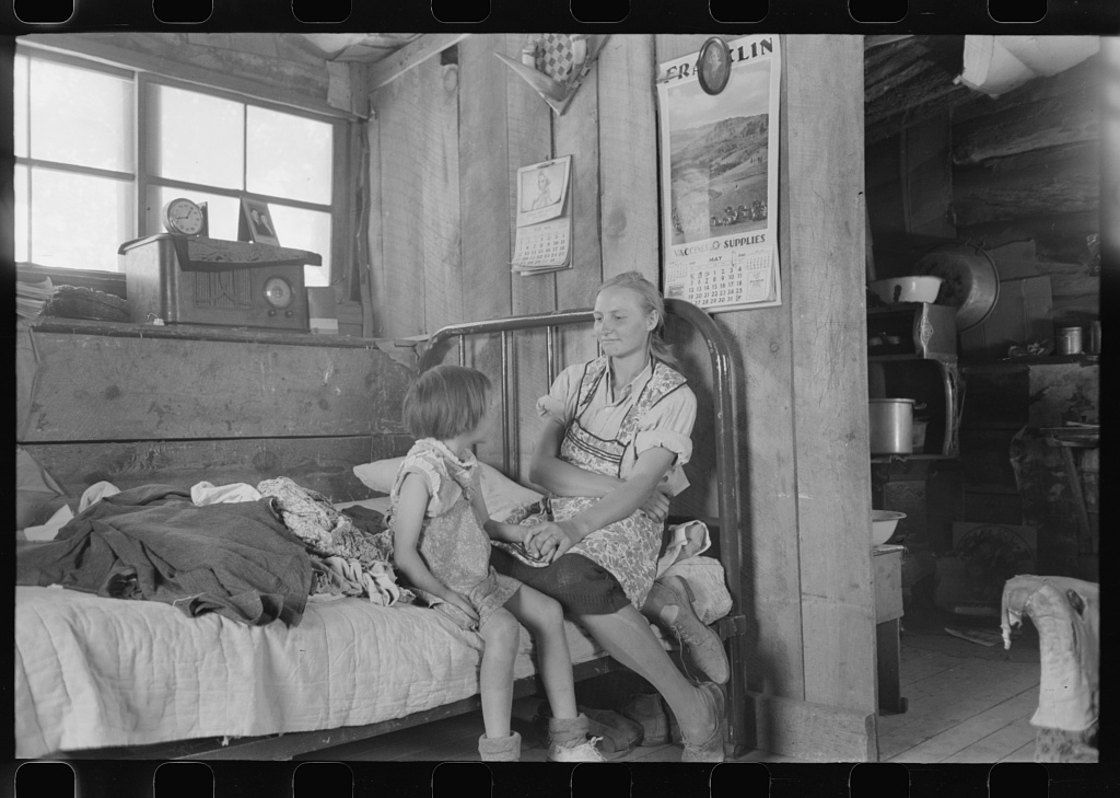 Woman and child listening to the radio, 1940